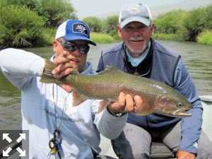 Guide Dave King, of King Outfitters, with a nice Montana rainbow caught and released by Mike Perez, from Sarasota, on a dry fly.