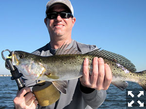 Michael Dinerman, from Atlanta, with a 23" trout caught and released on a CAL jig with a shad tail while fishing Little Sarasota Bay with Capt. Rick Grassett.