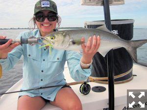 Mireya Castillo, from Salt Lake City, UT, with a nice bluefish caught on a fly while fishing with Capt. Rick Grassett in a previous December.