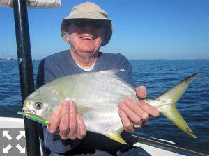 Walter Poxon, from MN, with a nice pompano caught on a CAL jig with a shad tail while fishing Sarasota Bay with Capt. Rick Grassett in a previous December.