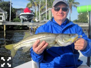 Rick Anderson, from IL, with a snook he caught and released on a CAL jig with a shad tail while fishing Little Sarasota Bay with Capt. Rick Grassett.