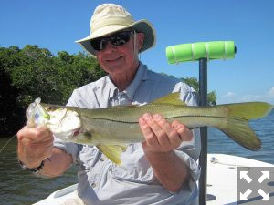 Keith McClintock, from Lake Forest, IL, with a snook caught and released on a CAL jig with a shad tail while fishing the Terra Ceia area with Capt. Rick Grassett. 