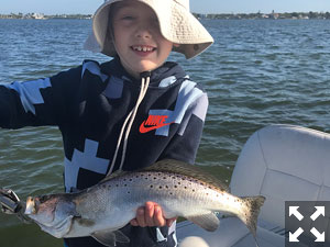 Eight year old Collin hooked and reeled in this larger trout.