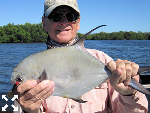 Sarasota winter resident, Denton Kent, with a permit caught and released on a CAL jig with a grub while fishing with Capt. Rick Grassett recently.