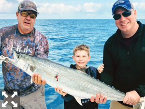 BFK displays the 25 pound kingfish he caught.