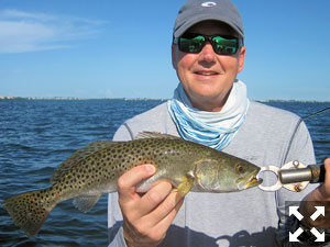 Jeff Babik, from IL, with a Sarasota Bay trout caught and released on a CAL jig with a shad tail while fishing with Capt. Rick Grassett.