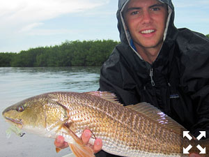 Connor Shoemaker, from Sarasota, with a red he caught and released on CAL Shad tails while fishing Gasparilla Sound with Capt. Rick Grassett.