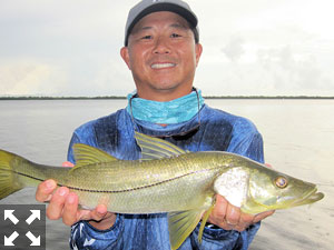 Jon Yenari, from Sarasota, with a snook he caught and released on CAL Shad tails while fishing Gasparilla Sound with Capt. Rick Grassett.