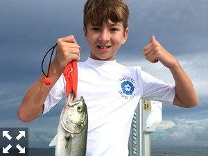 10 yr old Lawson Pressley of South Carolina with a nice bluefish he caught on a shrimp.