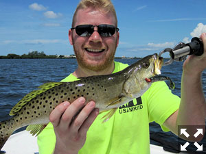 Eric Mickelson, from MD, with a trout he caught and released on a CAL jig with a shad tail while fishing Sarasota Bay with Capt. Rick Grassett.